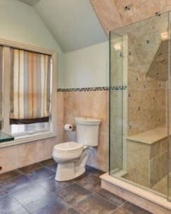 Warm-tone tiled bathroom remodel